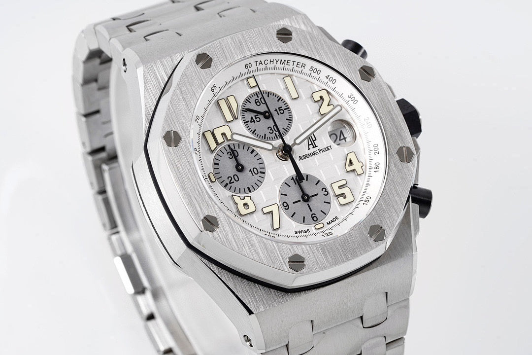 Silver-tone octagonal watch face with pushers and chronograph subdials, angled view