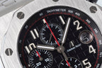 Close-up of black tachymeter chronograph dial with red seconds hand and subdial