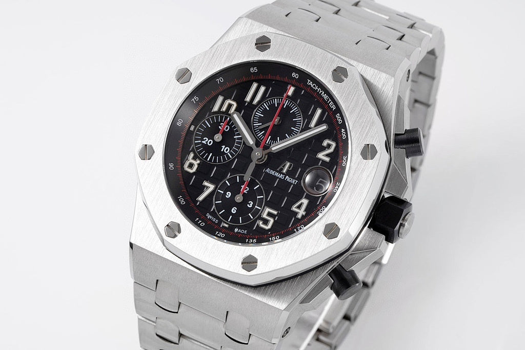 Stainless steel chronograph watch with black dial, red accents, and three subdials