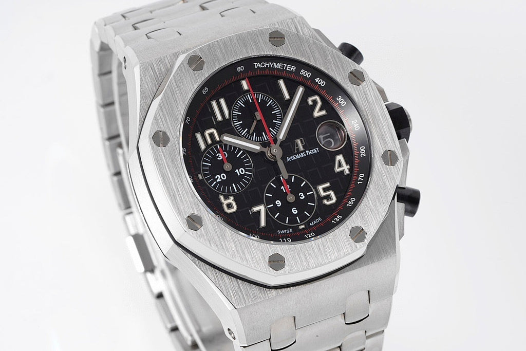 Stainless steel chronograph watch with black dial, tachymeter bezel, and three subdials