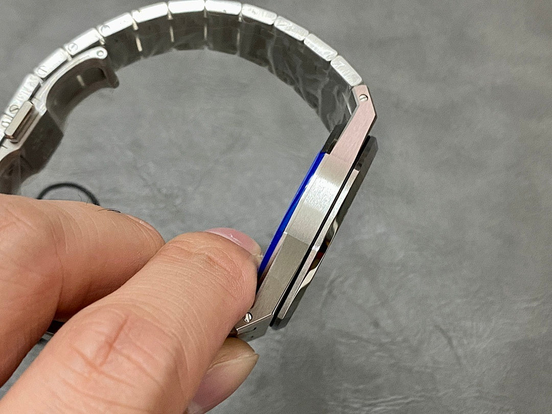 Audemars Piguet watch bracelet underside with metal links and blue protective tape