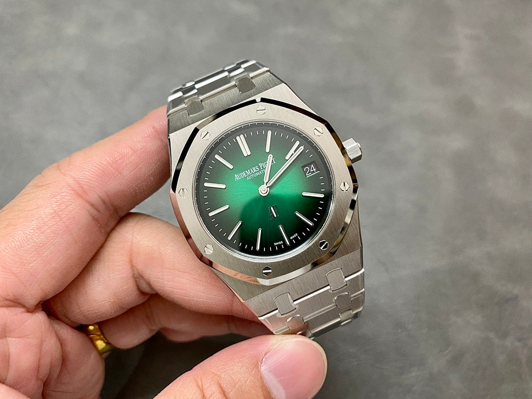 Audemars Piguet watch on hand with green dial and metal bracelet
