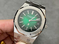 Audemars Piguet watch with green dial, metal bracelet, and date window at 24