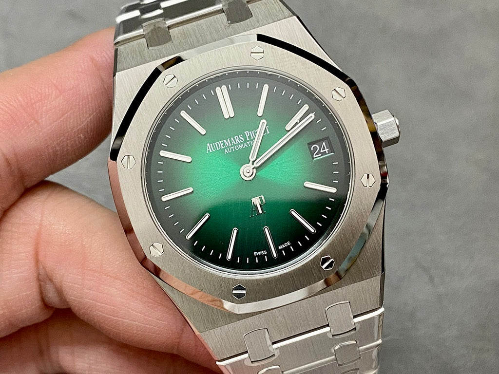 Audemars Piguet watch close-up with green dial, hour markers, and date at 24