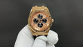 Gold-tone Audemars Piguet wristwatch with champagne dial and black rubber strap