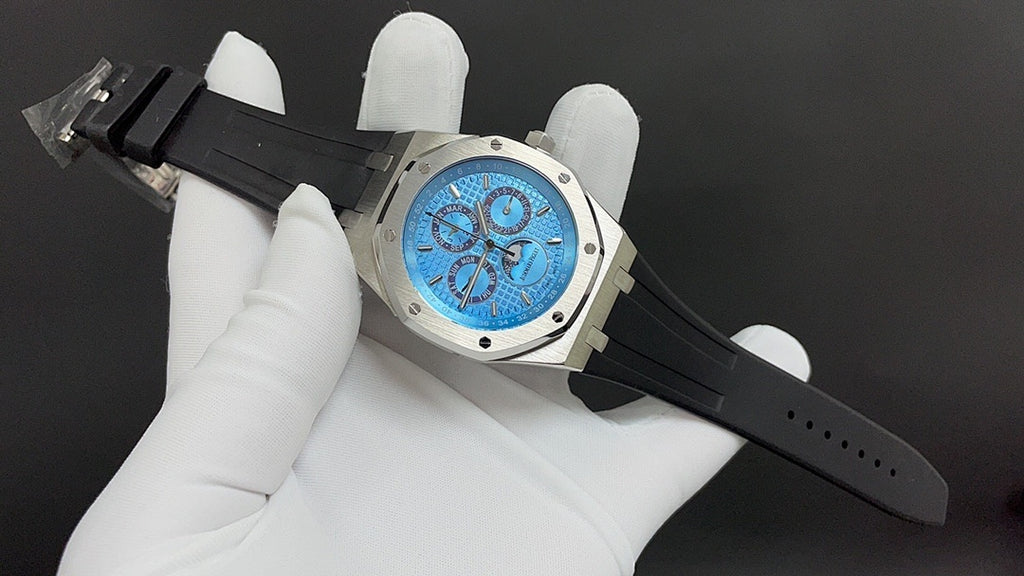 Audemars Piguet Royal Oak watch on black rubber strap, blue dial and steel case