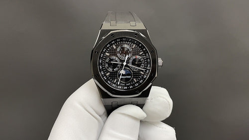 Audemars Piguet watch with black chronograph dial and metal octagonal case