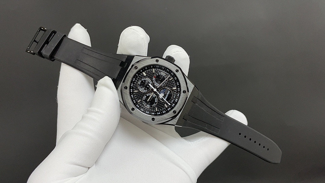 Audemars Piguet watch on black strap with metal case and chronograph dial
