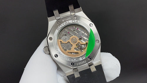 Audemars Piguet watch back view, silver case with visible movement