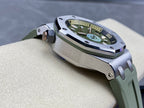 Audemars Piguet watch with green dial and green rubber strap, three-quarter view
