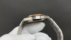 Audemars Piguet watch side profile with gold bezel edge and metal bracelet links