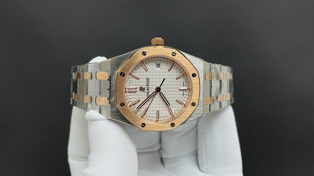 Audemars Piguet watch front view with gold accents, white dial, and linked bracelet