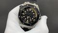 Audemars Piguet men's watch with stainless steel case, black dial, rubber strap