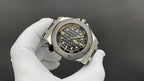 Audemars Piguet men's watch with stainless steel case, black dial, rubber strap, angled view