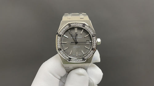 Audemars Piguet stainless-steel watch with dark dial and diamond-style bezel