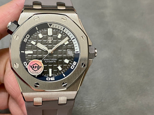 Audemars Piguet Royal Oak watch with dark dial, date window, steel bezel and bracelet