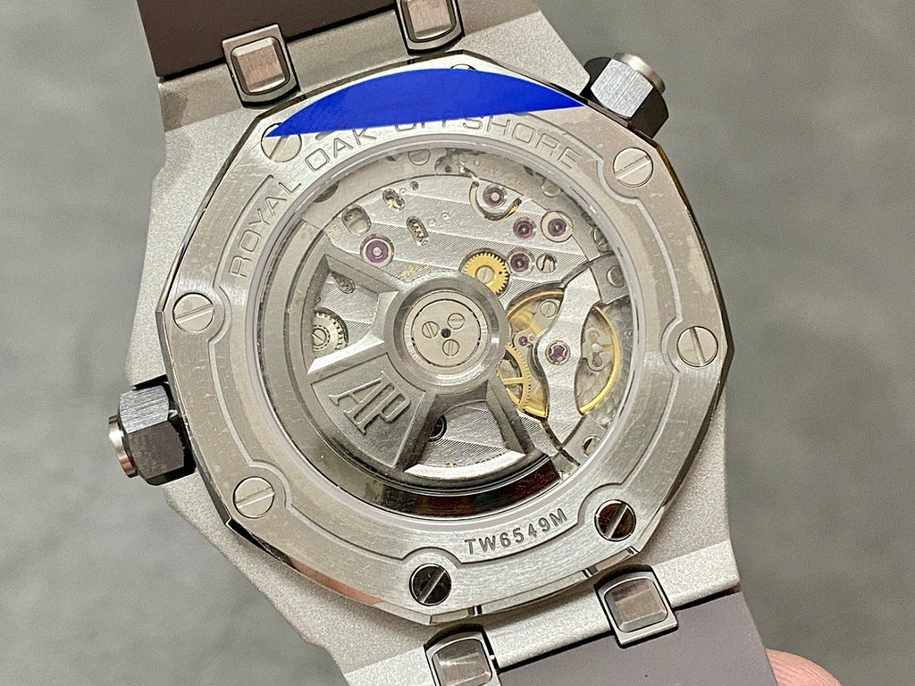 Audemars Piguet Royal Oak caseback with visible mechanical movement through a glass window
