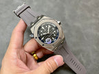 Audemars Piguet Royal Oak watch on rubber strap with dark dial and blue accents