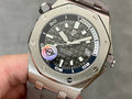 Audemars Piguet Royal Oak watch with dark dial and steel case, crown and pushers visible
