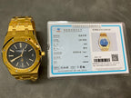 Gold-tone luxury wristwatch with blue dial, shown with authentication card