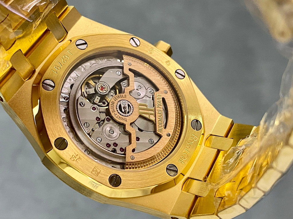 Gold-tone luxury wristwatch with visible mechanical movement, close-up caseback