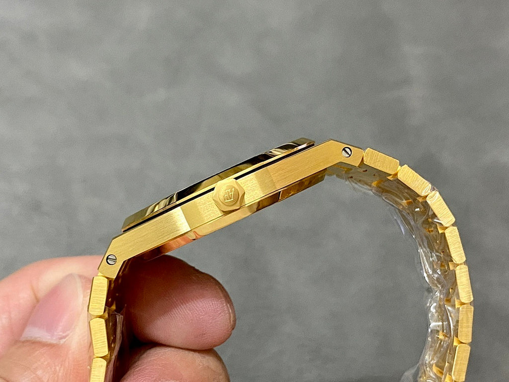 Gold-tone luxury wristwatch bracelet and clasp, viewed from the side