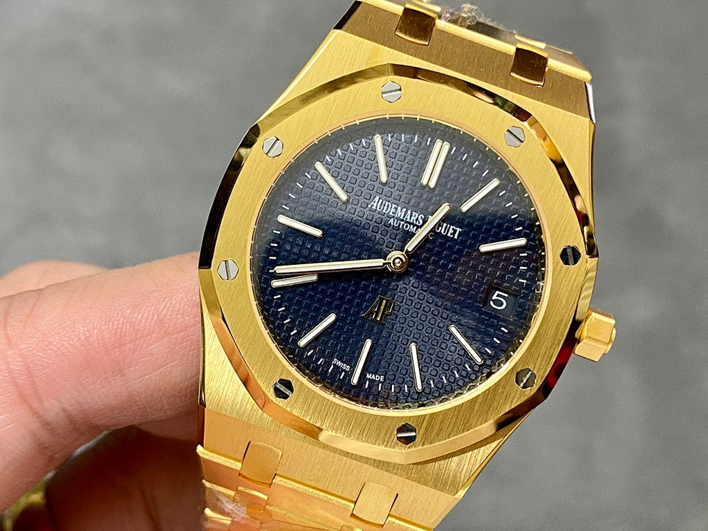 Gold-tone luxury wristwatch with blue textured dial and baton hour markers