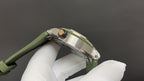 Audemars Piguet watch back with green strap and stainless steel case in hand