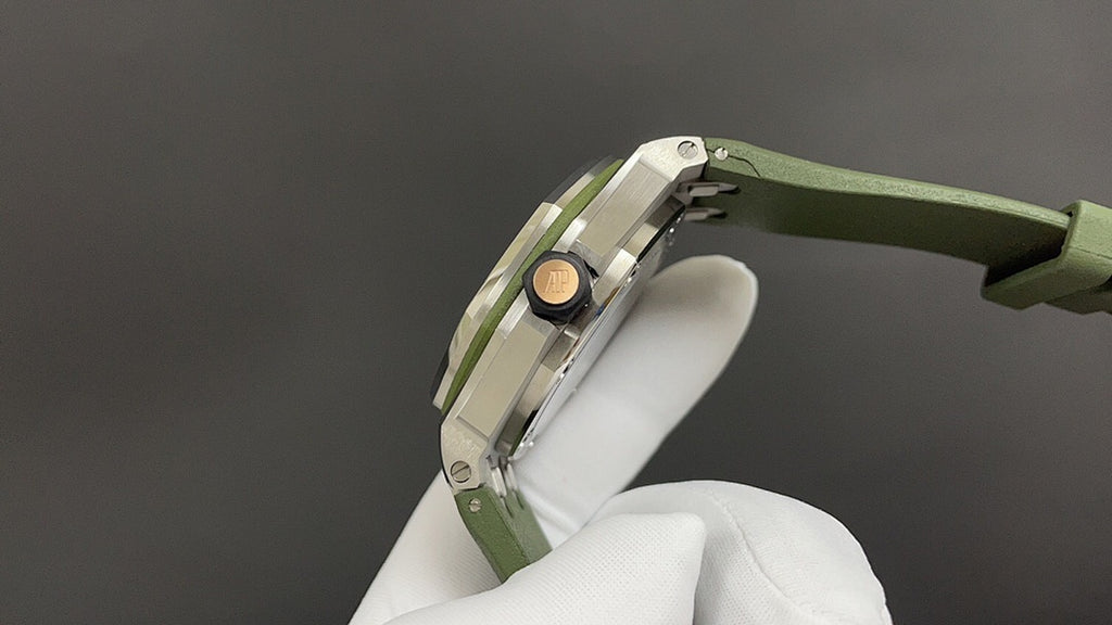 Audemars Piguet watch side view with crown and green rubber strap, steel case