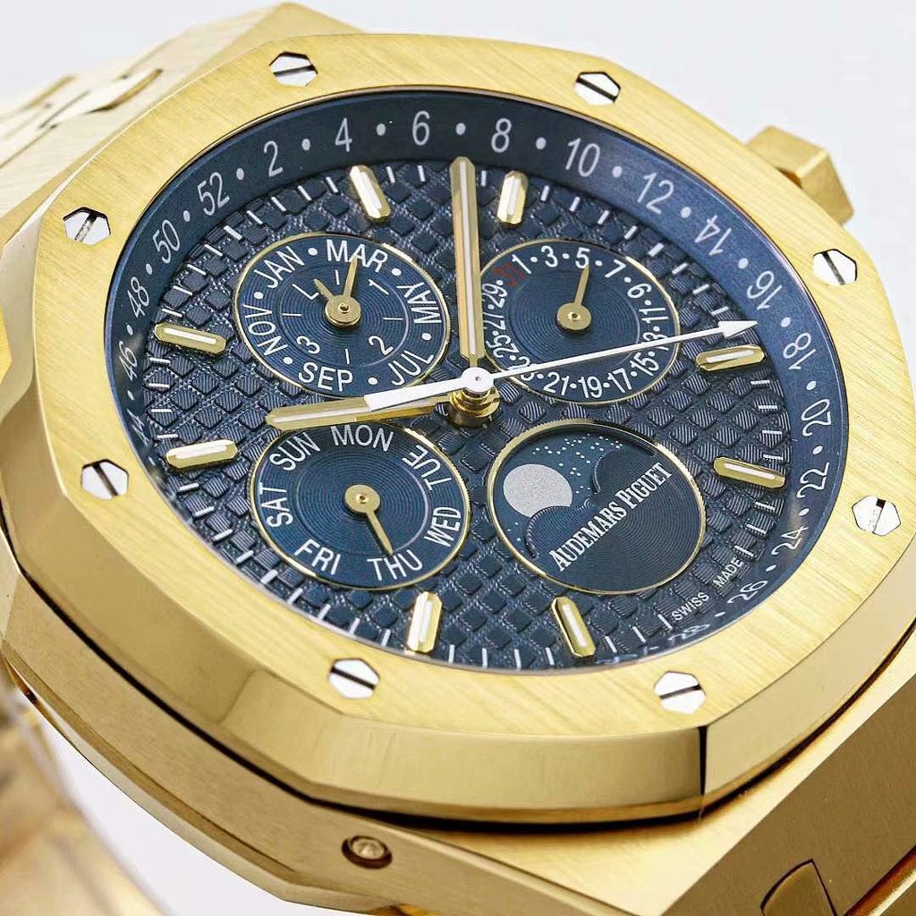 Gold-toned watch dial with moonphase display and day-date ring on dark blue