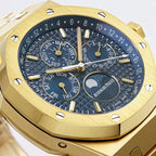 Gold-toned watch dial with moonphase display and day-date ring on dark blue