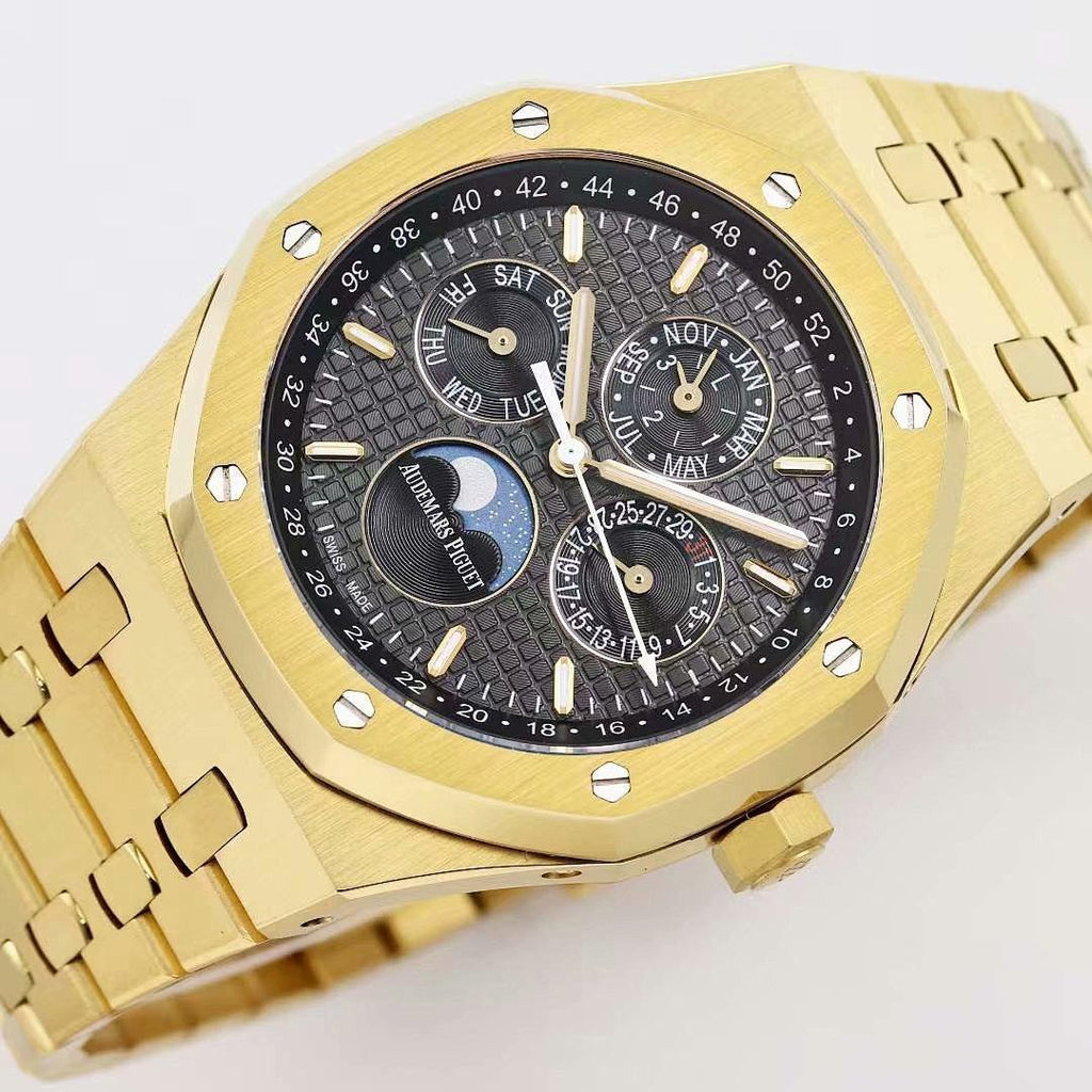 Audemars Piguet wristwatch close-up of gold-tone bezel and black multi-dial face
