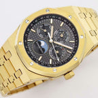 Audemars Piguet wristwatch close-up of gold-tone bezel and black multi-dial face