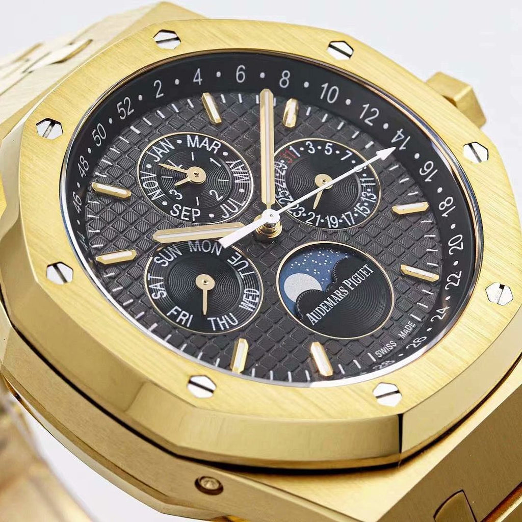 Audemars Piguet wristwatch dial close-up with black subdials and gold markers
