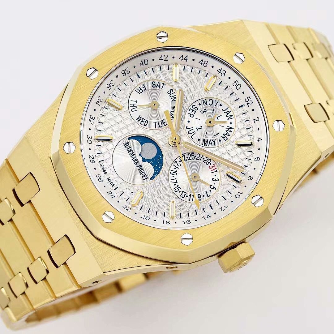 Gold-tone Audemars Piguet watch face with white dial, multiple subdials and date markers