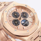 Audemars Piguet rose gold-tone watch face close-up with subdials and day/date scales.