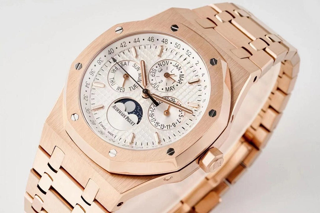 Rose gold wristwatch with white dial, subdials, and calendar markings