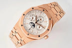 Rose gold wristwatch with white dial, subdials, and date window