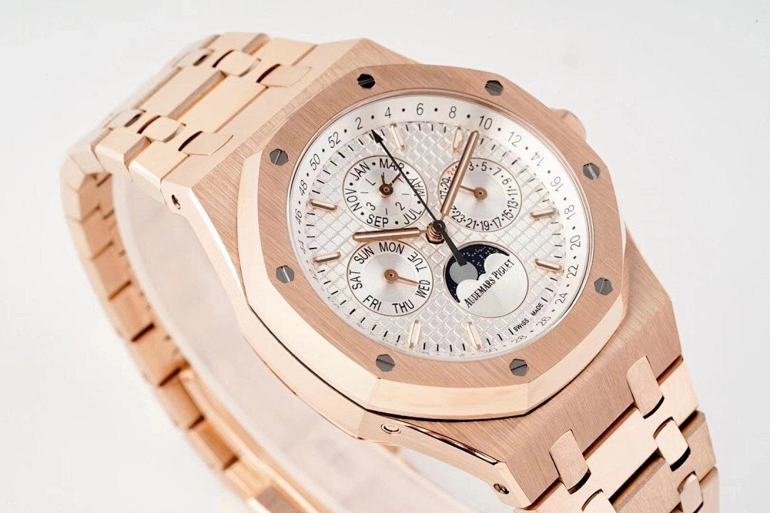 Rose gold wristwatch with white dial, multiple subdials, and crown