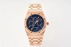 Rose gold-tone wristwatch with blue dial and three subdials, on matching bracelet.