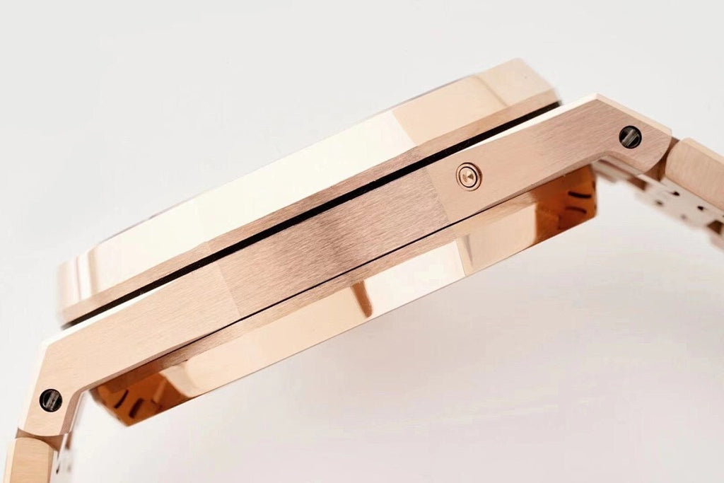 Rose gold-tone watch case side with brushed finish and crown/connector details.