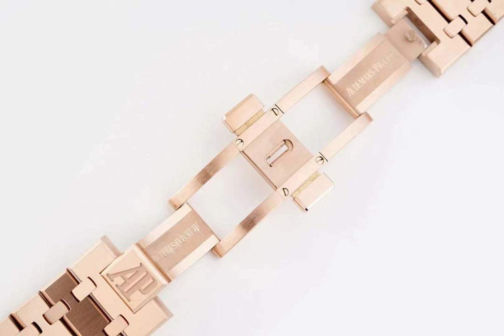 Audemars Piguet rose gold bracelet with center logo bar and hinged clasp