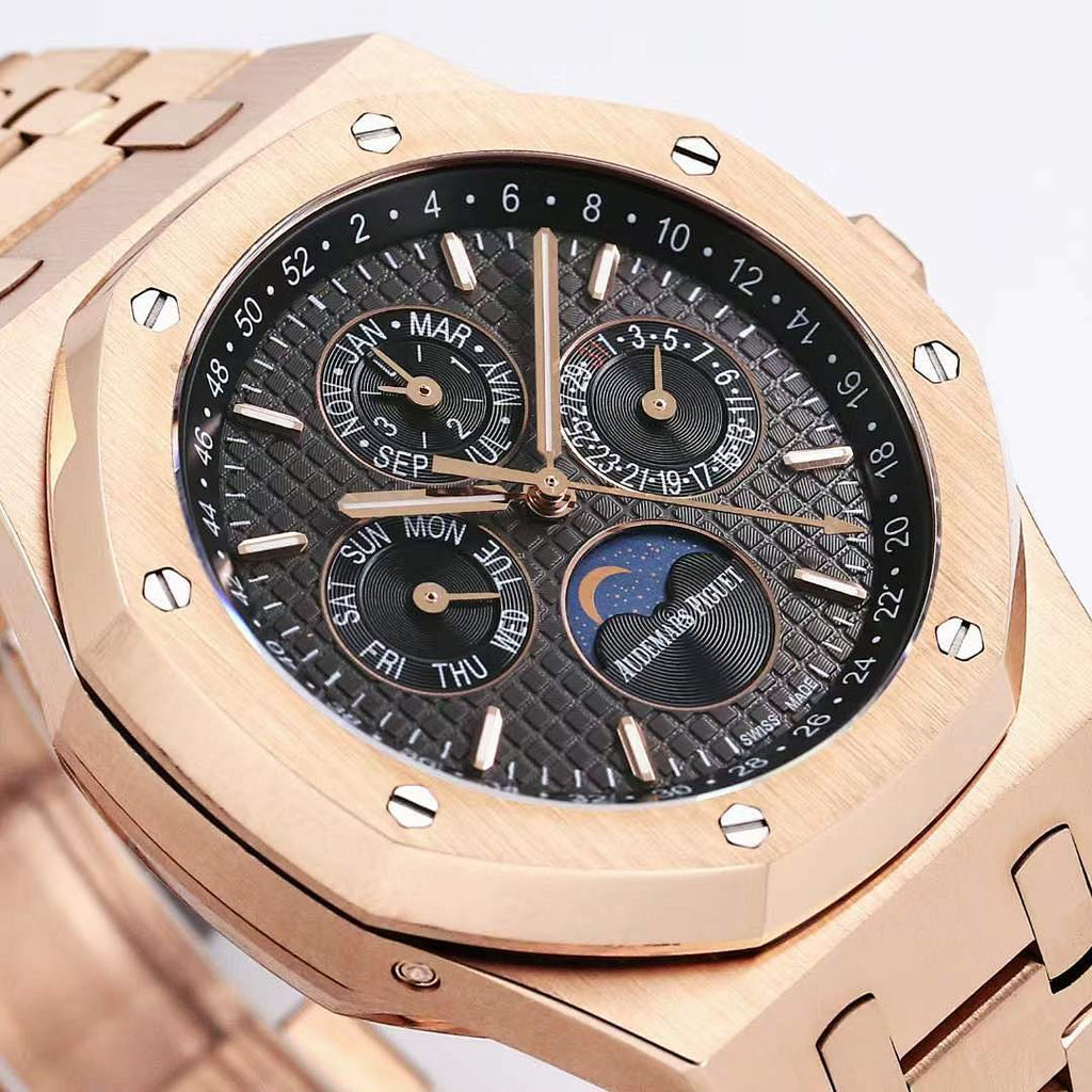 Audemars Piguet rose gold watch face with black dial and blue moonphase disc