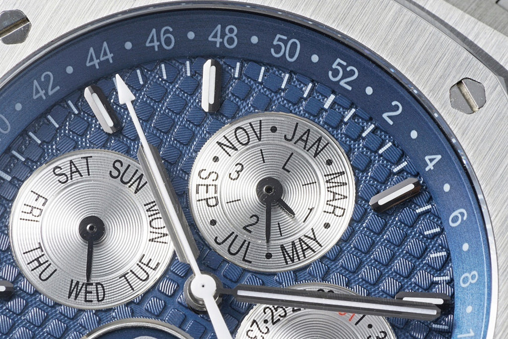 Audemars Piguet blue dial close-up with day/date display and hour markers