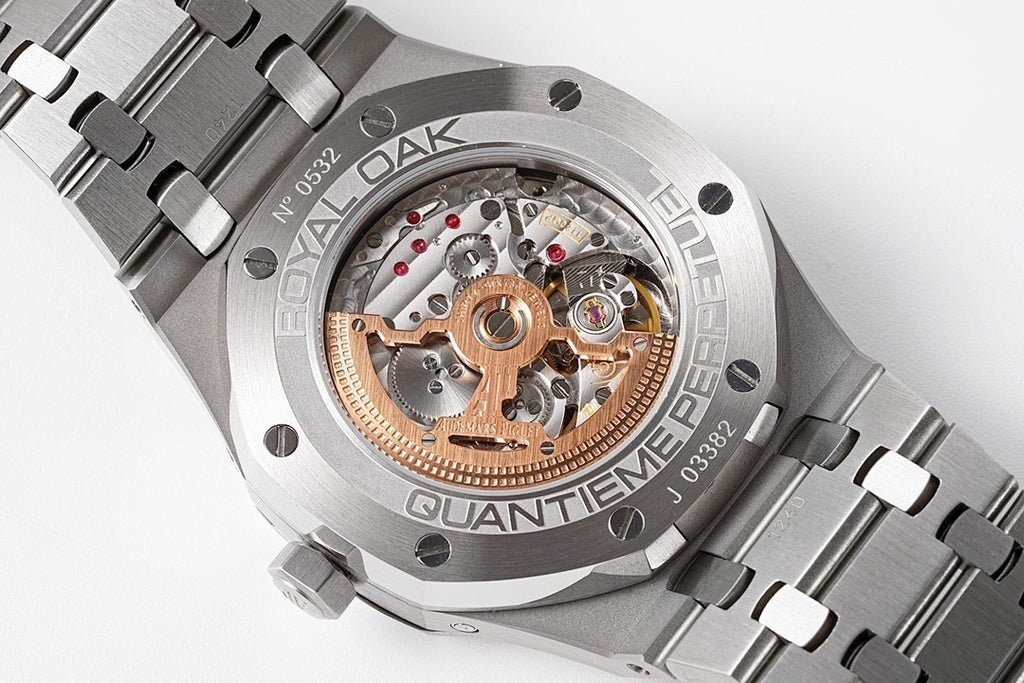 Audemars Piguet steel watch open dial showing skeleton movement and gold accents