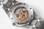 Audemars Piguet steel watch open dial showing skeleton movement and gold accents