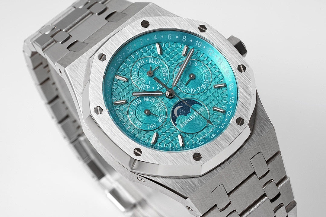Audemars Piguet steel watch face with bright teal dial and three subdials