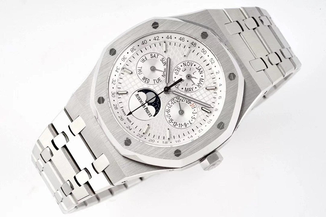 Stainless steel watch with white dial, multiple subdials, and date text