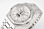 Stainless steel watch close-up with white dial, subdials, and day/date text