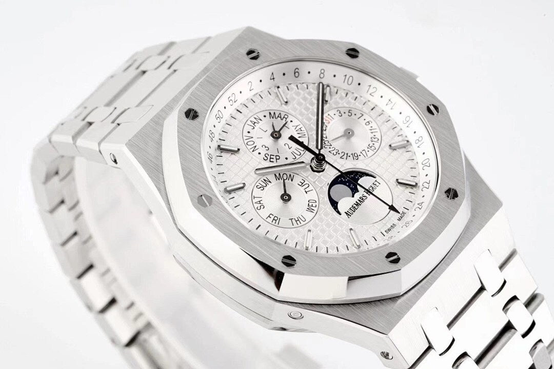Stainless steel watch with white dial and visible chronograph hands and subdials
